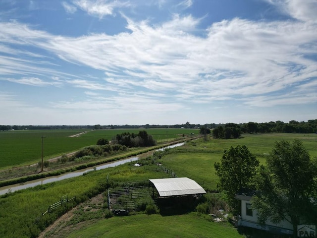 birds eye view of property with a rural view
