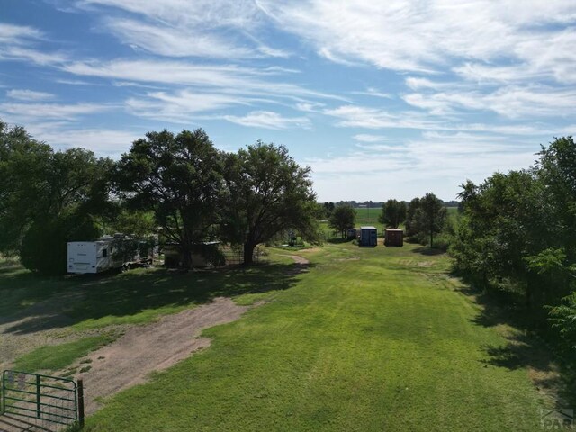 view of yard with a rural view