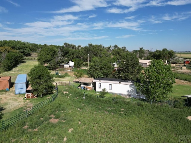 birds eye view of property with a rural view