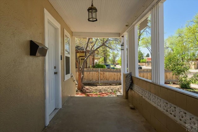 exterior space with fence and stucco siding
