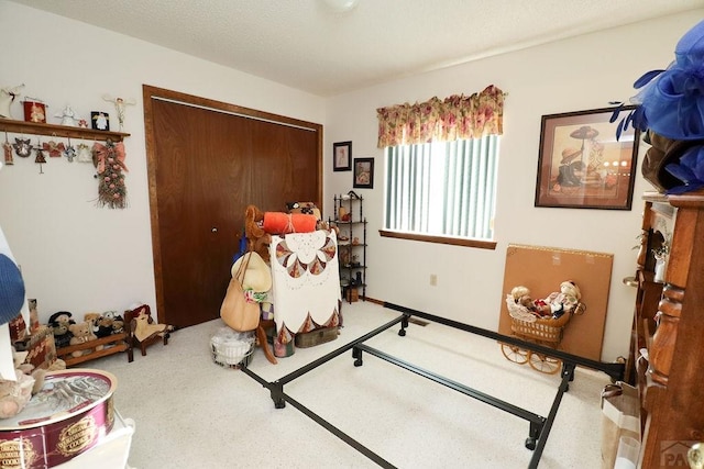 carpeted bedroom with a closet