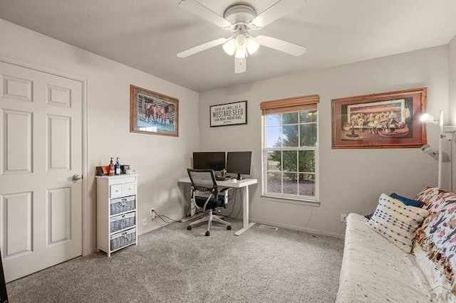 office featuring a ceiling fan and carpet