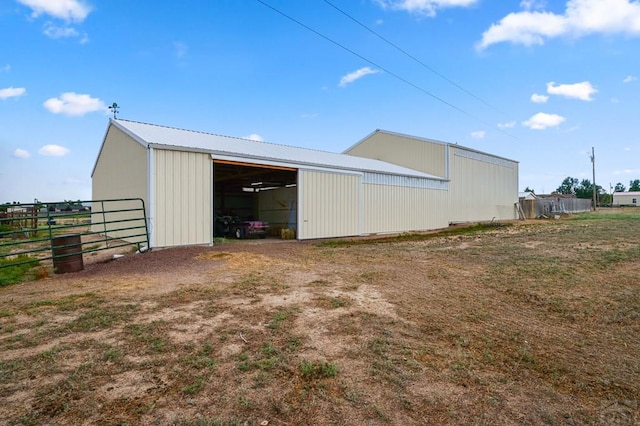 view of pole building with fence