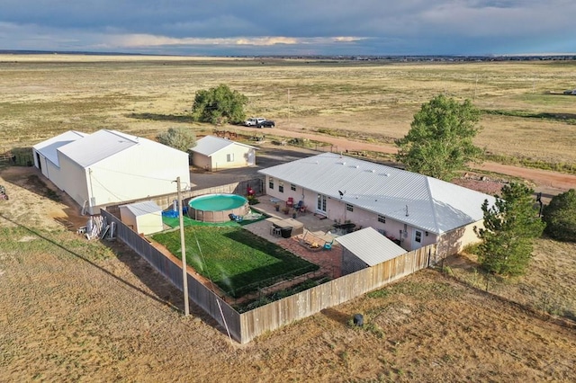 birds eye view of property featuring a rural view