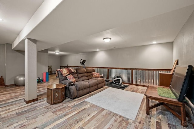 living area featuring light wood finished floors and recessed lighting