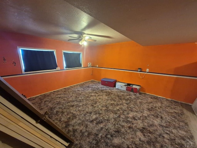 unfurnished bedroom with carpet flooring and a textured ceiling