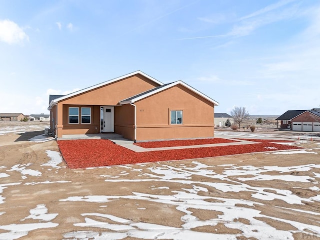 view of front of house featuring stucco siding