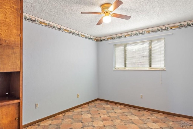 unfurnished room featuring baseboards, light floors, a textured ceiling, and ceiling fan