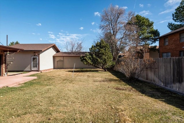 view of yard with a fenced backyard