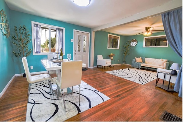 1232 Spruce St, Pueblo, CO 81004 - dining room featuring baseboards, wood finished floors, and ceiling fan