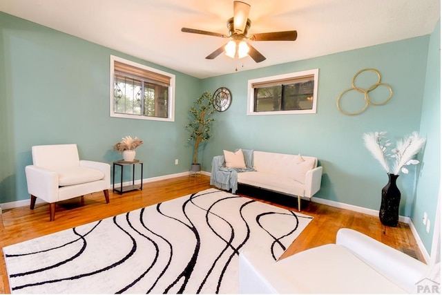1232 Spruce St, Pueblo, CO 81004 - living room with wood finished floors, a ceiling fan, and baseboards