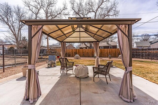 view of patio / terrace featuring a gazebo and a fenced backyard