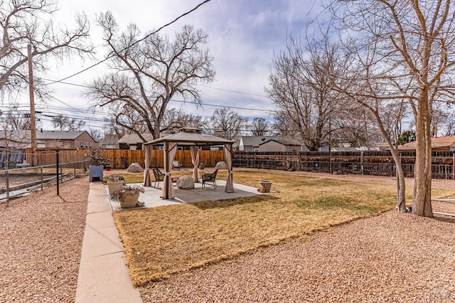 view of yard with a gazebo, a patio area, and a fenced backyard