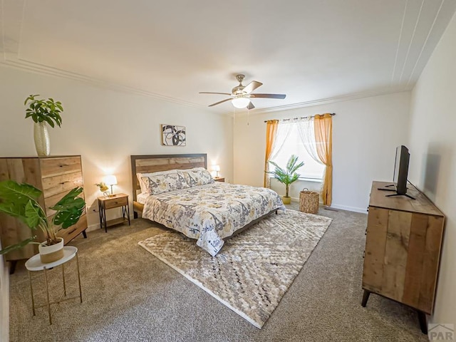 carpeted bedroom with ornamental molding, a ceiling fan, and baseboards