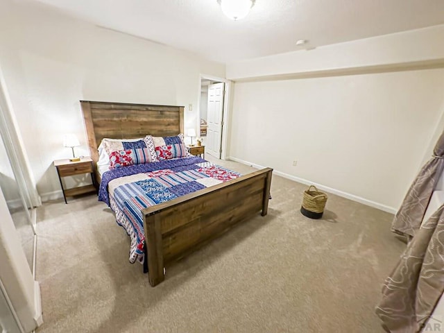 carpeted bedroom with baseboards