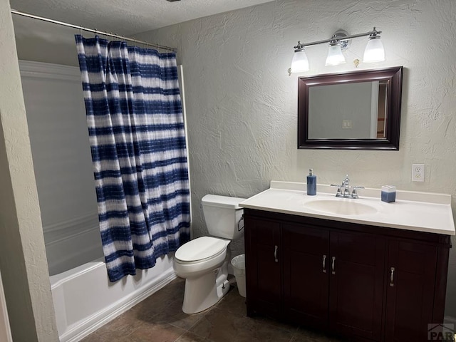 bathroom featuring shower / tub combo, a textured wall, toilet, a textured ceiling, and vanity