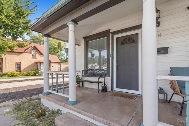 view of exterior entry featuring a porch