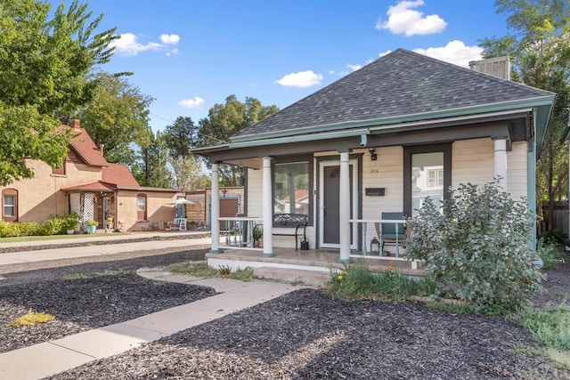 view of front of house featuring a porch and roof with shingles