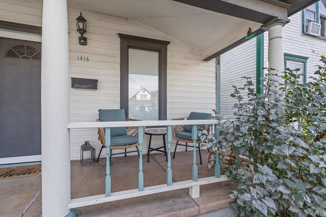 view of patio / terrace featuring cooling unit and covered porch