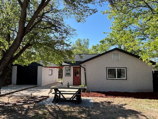 521 Tyler St, Pueblo, CO 81004 - view of front facade with stucco siding, a patio, and an outdoor structure
