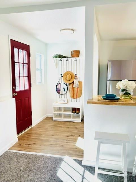 521 Tyler St, Pueblo, CO 81004 - mudroom with baseboards and wood finished floors