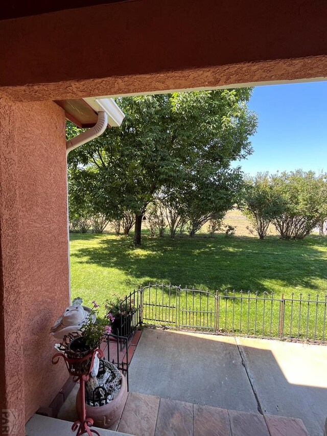 view of patio featuring fence