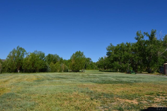 view of yard with a rural view