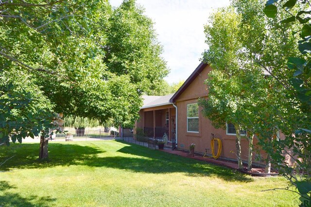 view of yard featuring fence