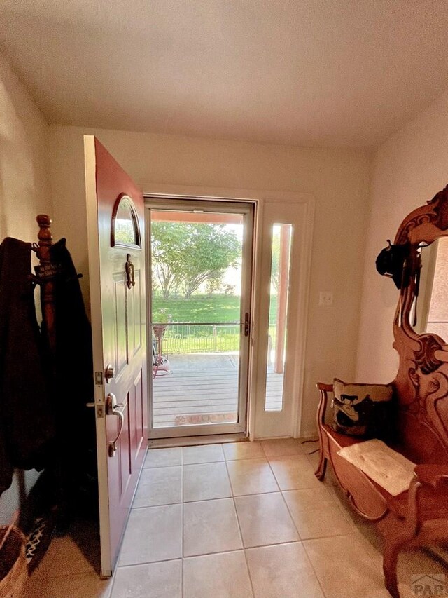 entryway with light tile patterned floors