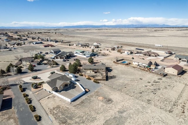 bird's eye view featuring a desert view and a mountain view