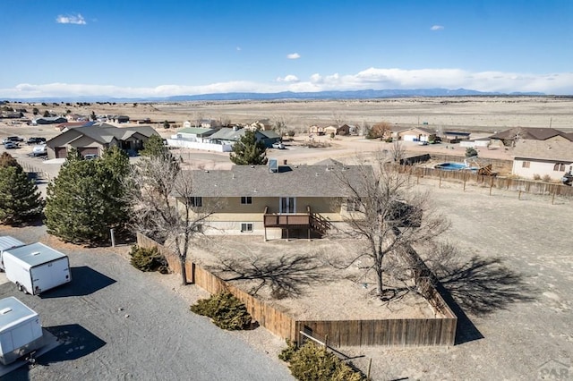 bird's eye view with a residential view, a desert view, and a mountain view