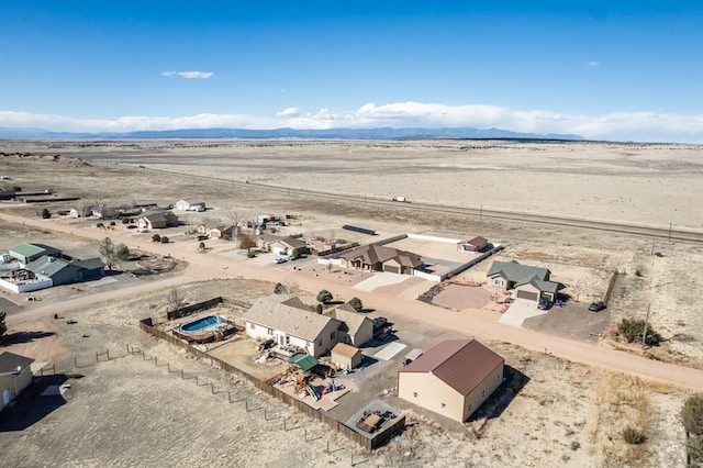 aerial view with a desert view and a mountain view