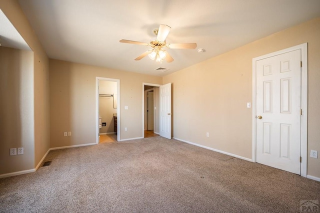 unfurnished bedroom with carpet floors, a ceiling fan, visible vents, and baseboards