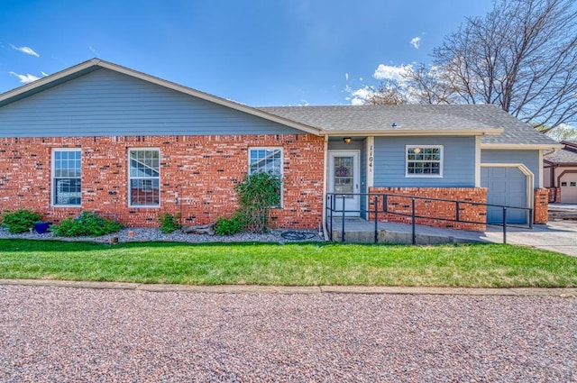 1104 Fairview Ave Unit A, Canon City, CO 81212 - single story home featuring brick siding, a garage, and a front lawn