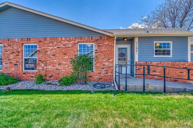 1104 Fairview Ave Unit A, Canon City, CO 81212 - single story home featuring brick siding and a front lawn