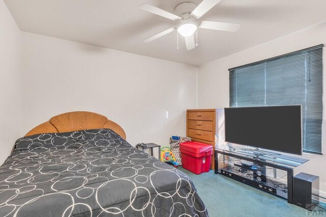 carpeted bedroom with a ceiling fan