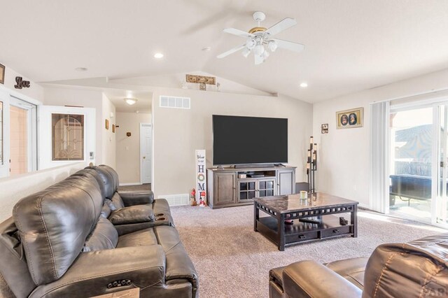 living area with lofted ceiling, recessed lighting, light colored carpet, visible vents, and a ceiling fan