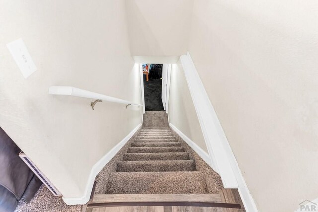 stairway with baseboards