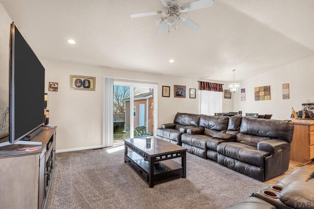 living area with baseboards, a ceiling fan, carpet, vaulted ceiling, and recessed lighting