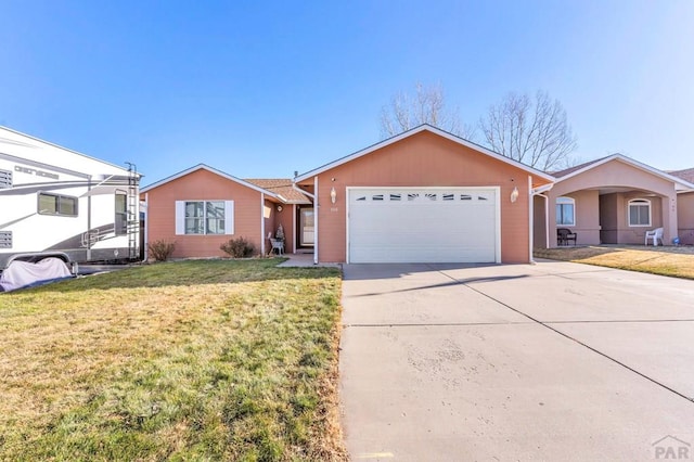 ranch-style house with driveway, an attached garage, and a front yard