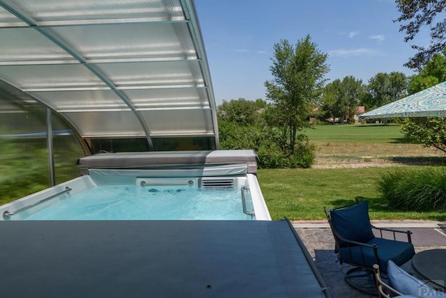 view of swimming pool featuring a lawn