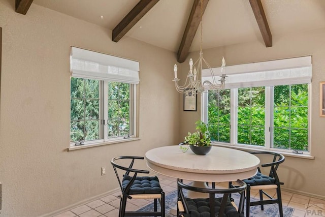 dining space featuring lofted ceiling with beams, plenty of natural light, a notable chandelier, and light tile patterned flooring