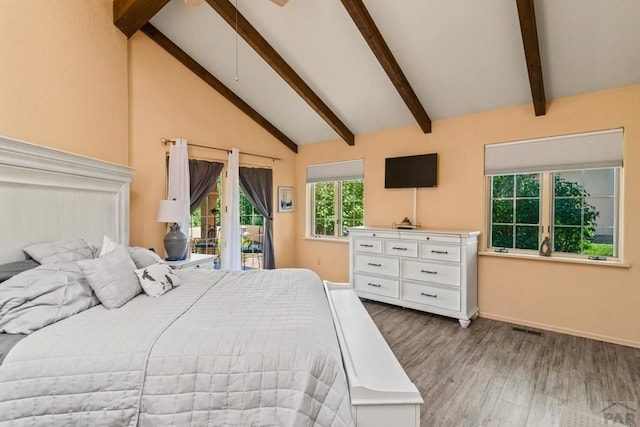 bedroom featuring access to exterior, beam ceiling, visible vents, and wood finished floors