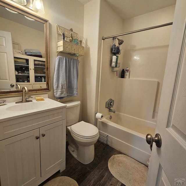1819 W Arroyo Ave, Pueblo, CO 81004 - bathroom featuring wood finished floors, tub / shower combination, and vanity