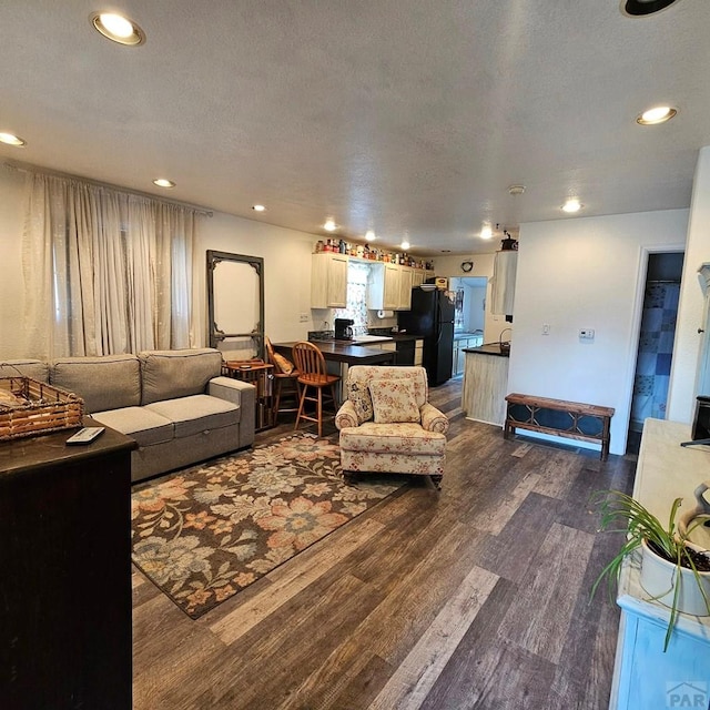1819 W Arroyo Ave, Pueblo, CO 81004 - living room with dark wood-style flooring and recessed lighting
