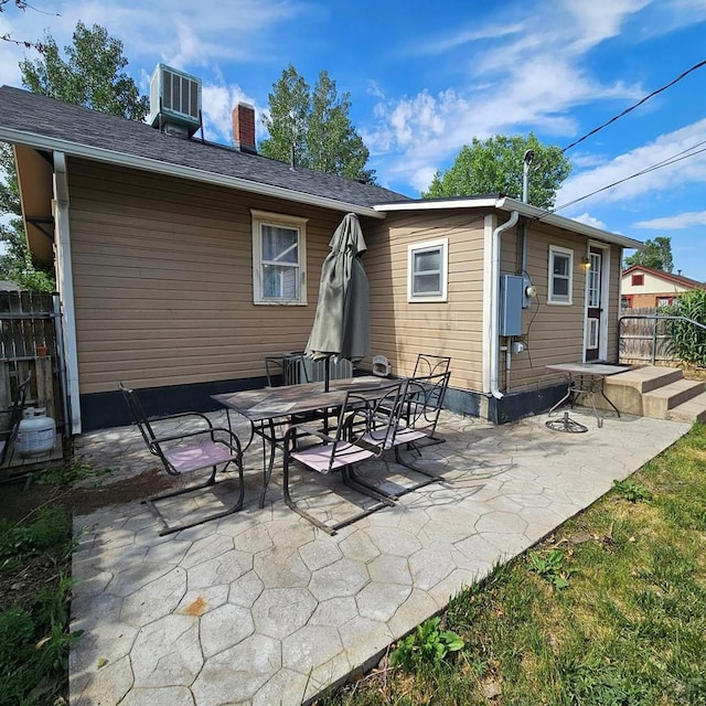 1819 W Arroyo Ave, Pueblo, CO 81004 - rear view of house with a chimney and a patio