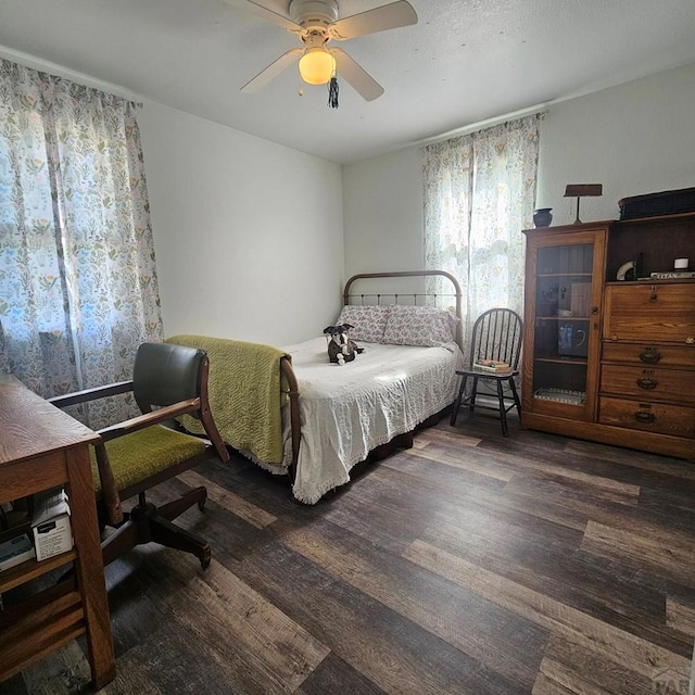 1819 W Arroyo Ave, Pueblo, CO 81004 - bedroom with dark wood-type flooring and ceiling fan