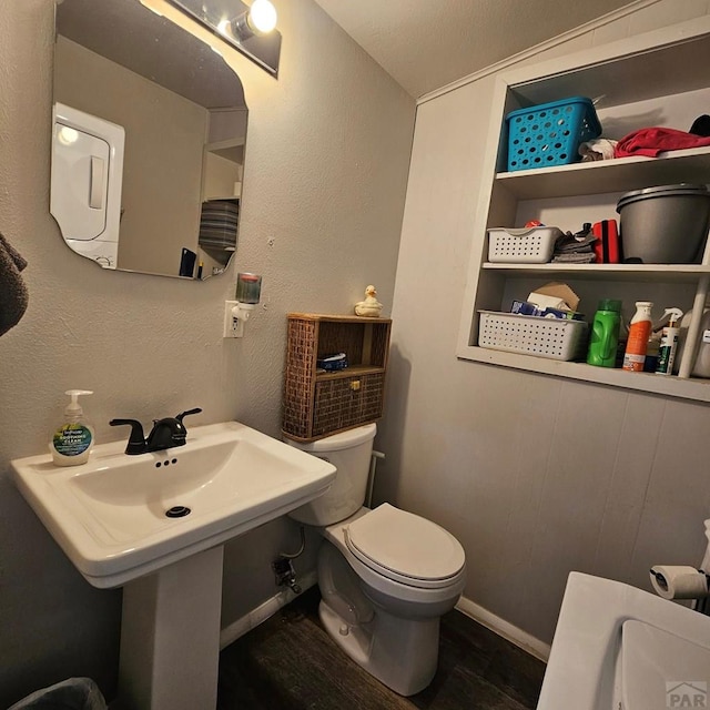 1819 W Arroyo Ave, Pueblo, CO 81004 - half bath featuring toilet and wood finished floors
