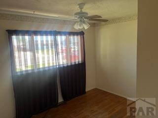 2013 Elmwood Ln, Pueblo, CO 81005 - spare room featuring ceiling fan and wood finished floors