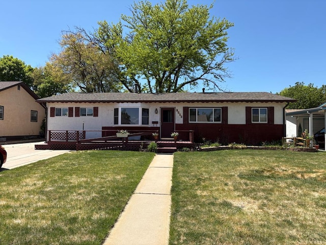 2013 Elmwood Ln, Pueblo, CO 81005 - ranch-style home with a front yard and stucco siding